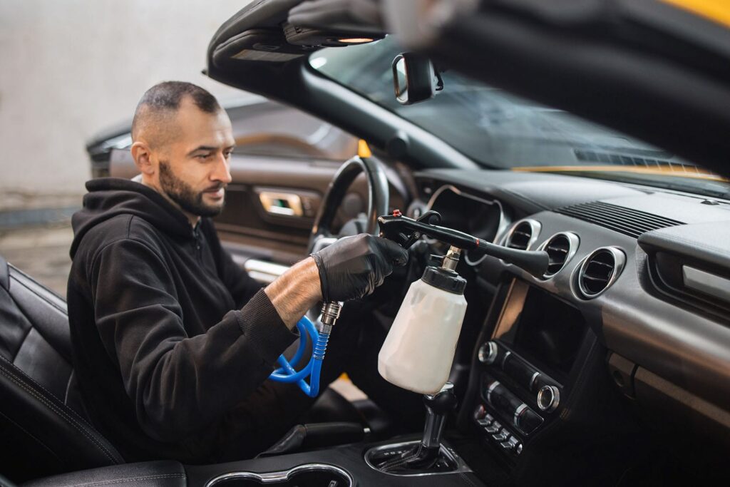 handsome-male-cleaner-in-black-uniform-and-protect-min