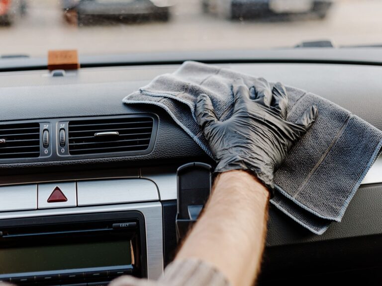 man-s-hand-in-black-glove-cleaning-car-interior-d-min